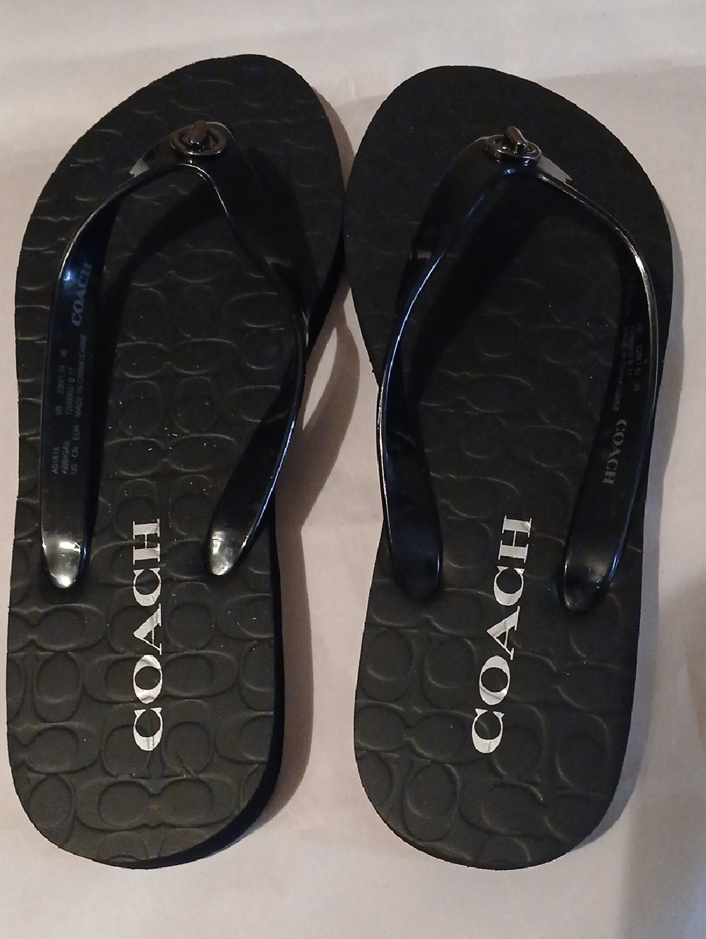 Coach Black Logo Embossed Flip Flops